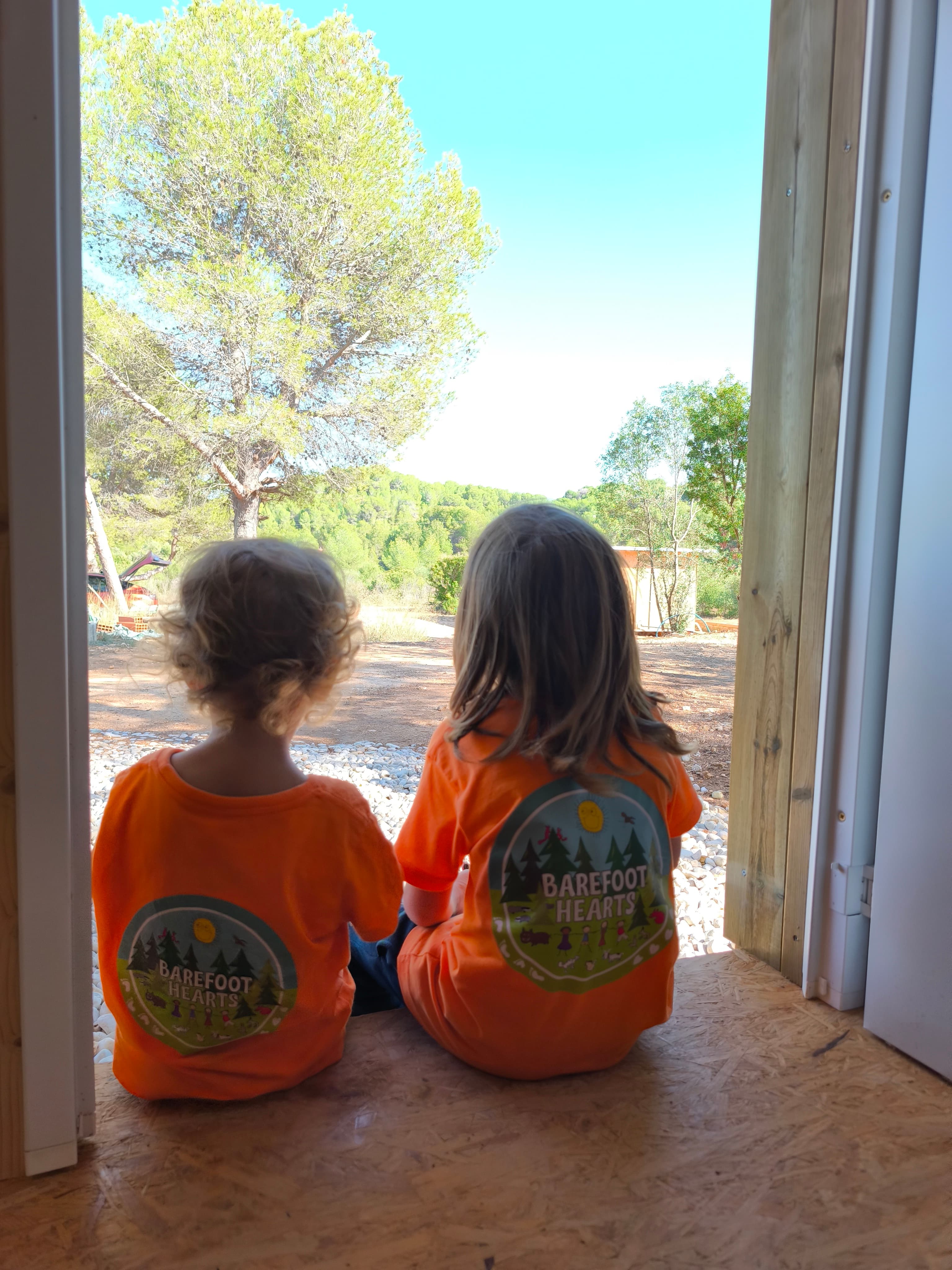 Children in Barefoot Hearts t-shirts at the school